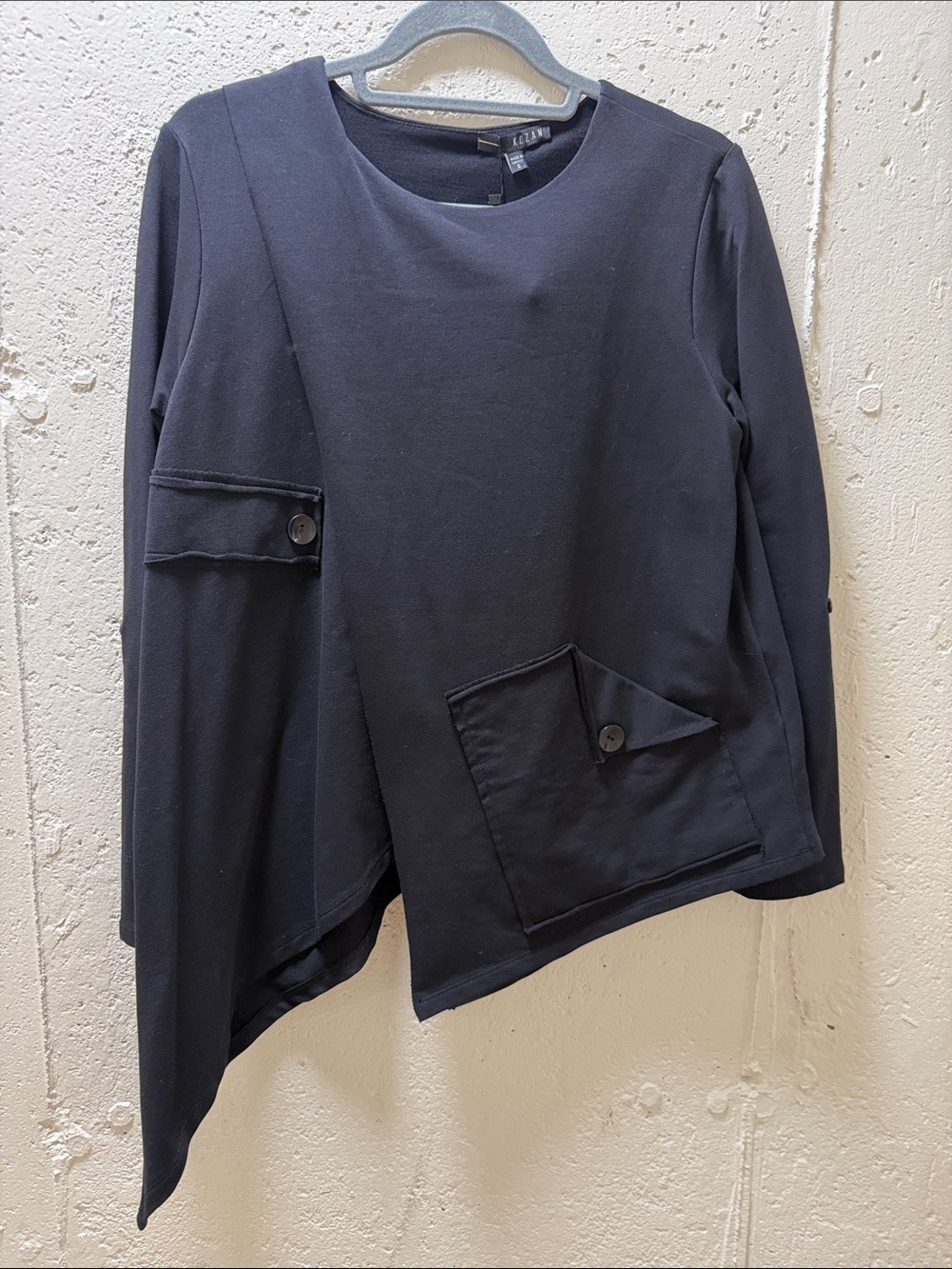 Asymmetric Black Long-Sleeve Knit with Button Pocket Detail